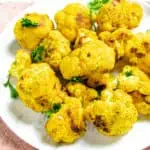 roasted turmeric cauliflower on a white plate