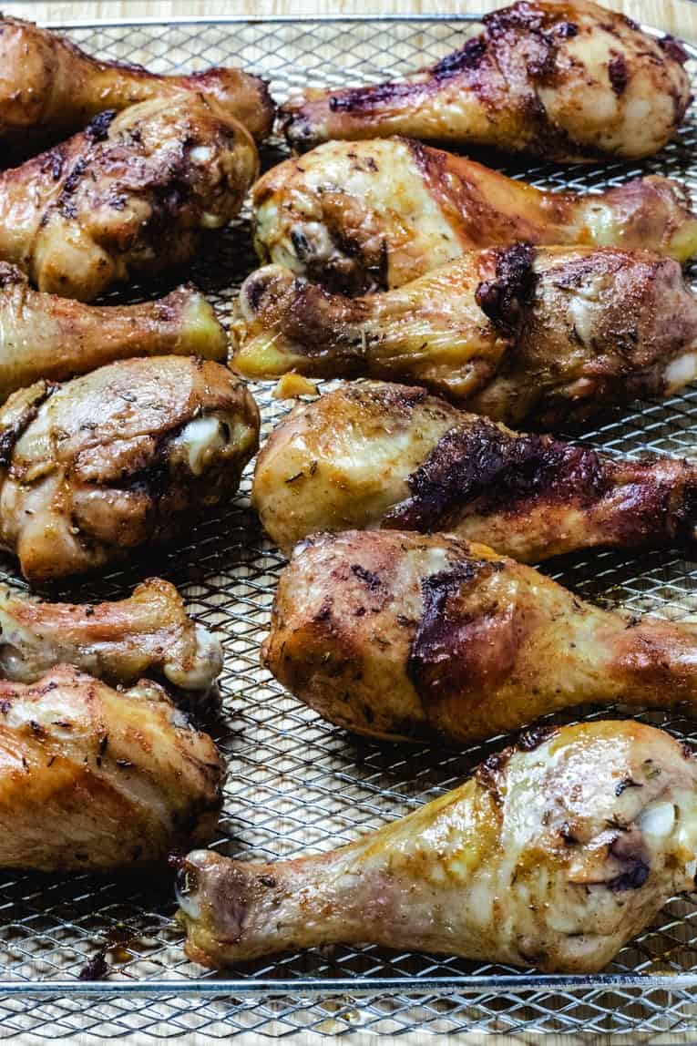 baked chicken drumsticks lined on a tray