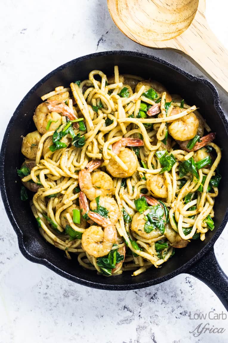 low carb palmini noodles cooking on a skillet