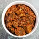 Nigerian Ofada Ayamase Stew in a white bowl.