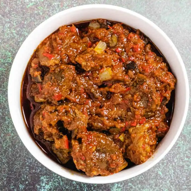 Nigerian Ofada Ayamase Stew in a white bowl.