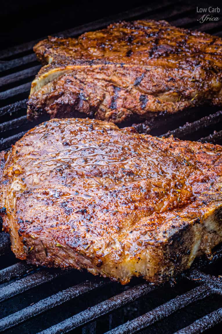 t-bone steak on grill.