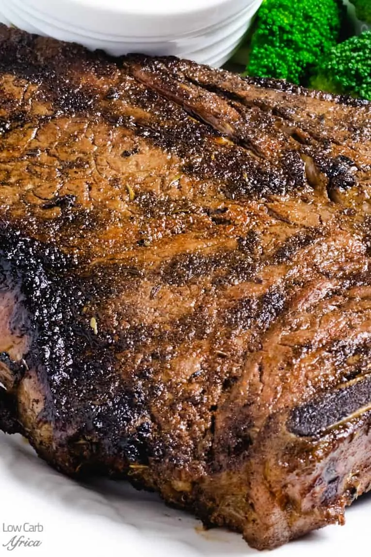 A close-up image of a grilled T-bone steak.