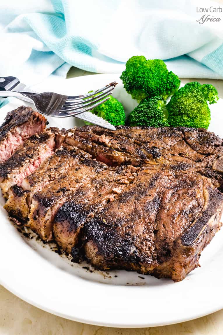 keto grilled steak on a white plate ready to eat.