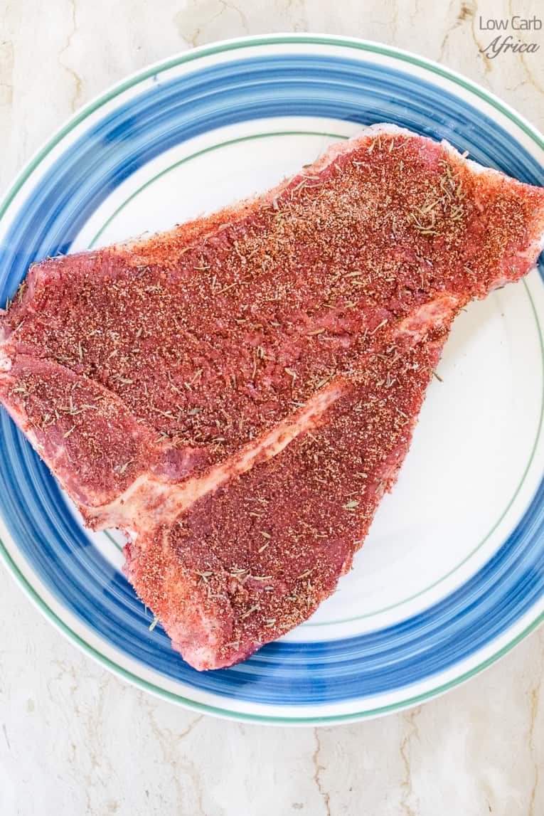 t-bone steak on a plate with homemade dry rub.