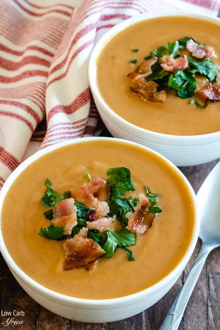 two bowls of low carb keto cauliflower soup with bacon