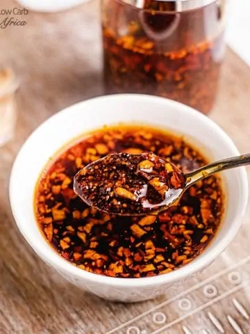 a spoon scooping up chili oil
