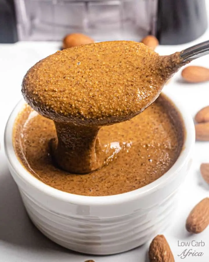 spoon scooping almond butter