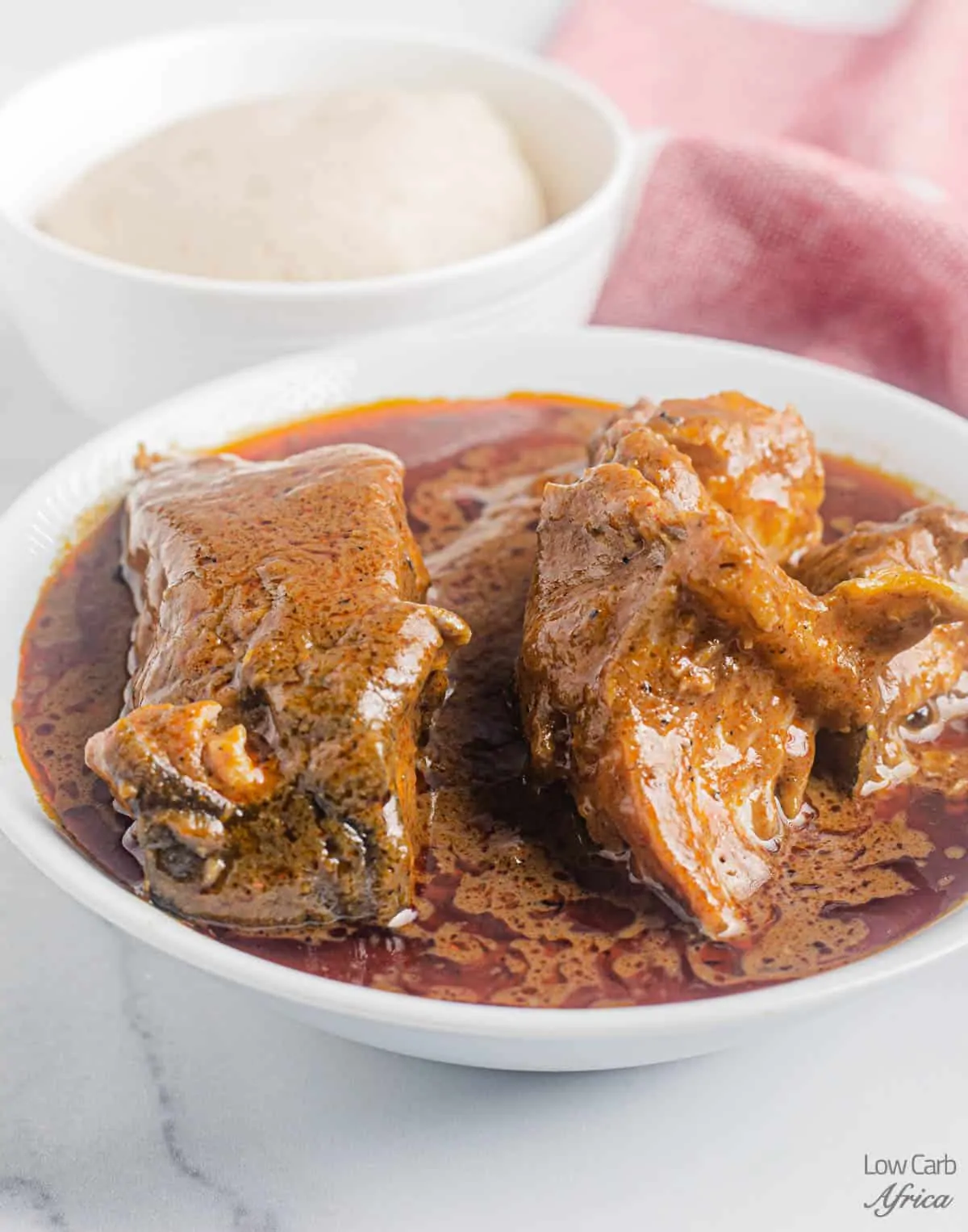 bowl of low carb fufu and palm nut soup