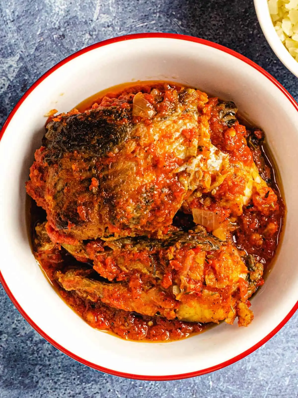 African fish stew in white bowl