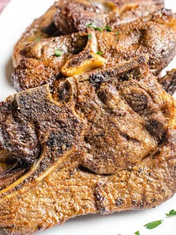 air fryer lamb chops on a white plate