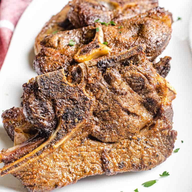 air fryer lamb chops on a white plate