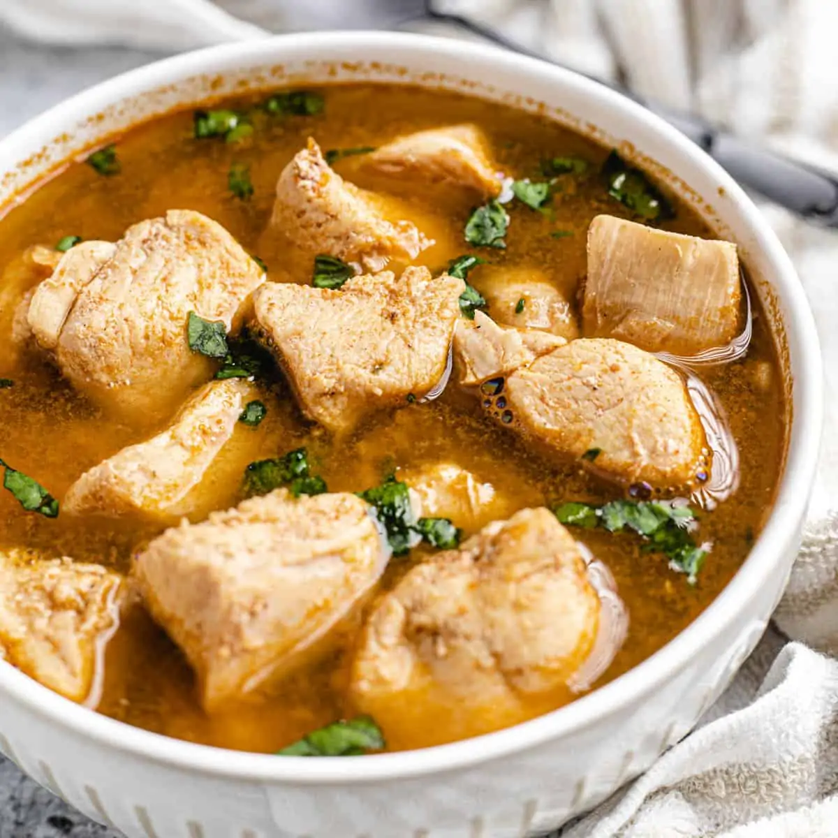 nigerian chicken pepper soup on a white bowl