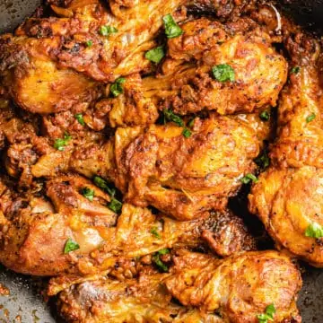 congolese moambe chicken in a skillet