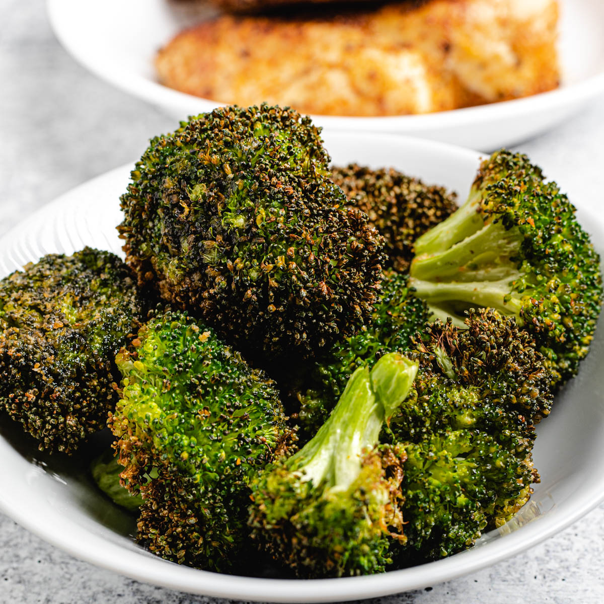 roasted broccoli in white plate