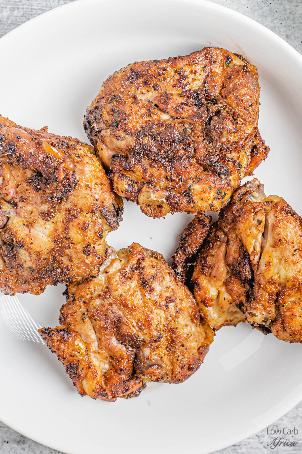 Air Fryer Chicken Thighs on a white plate