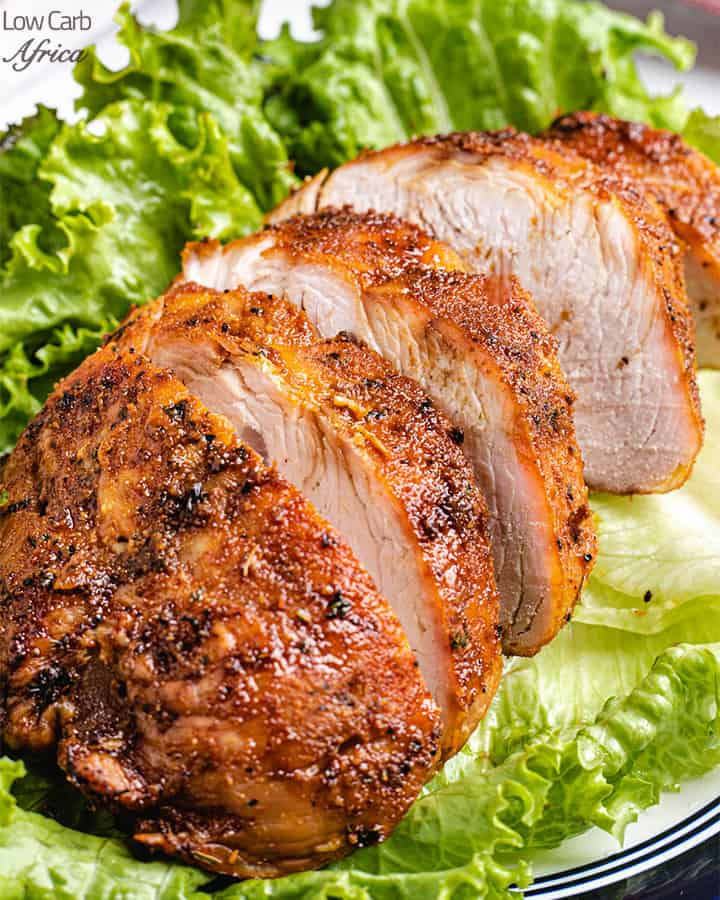 sliced air fryer turkey breast served on a bed of lettuce