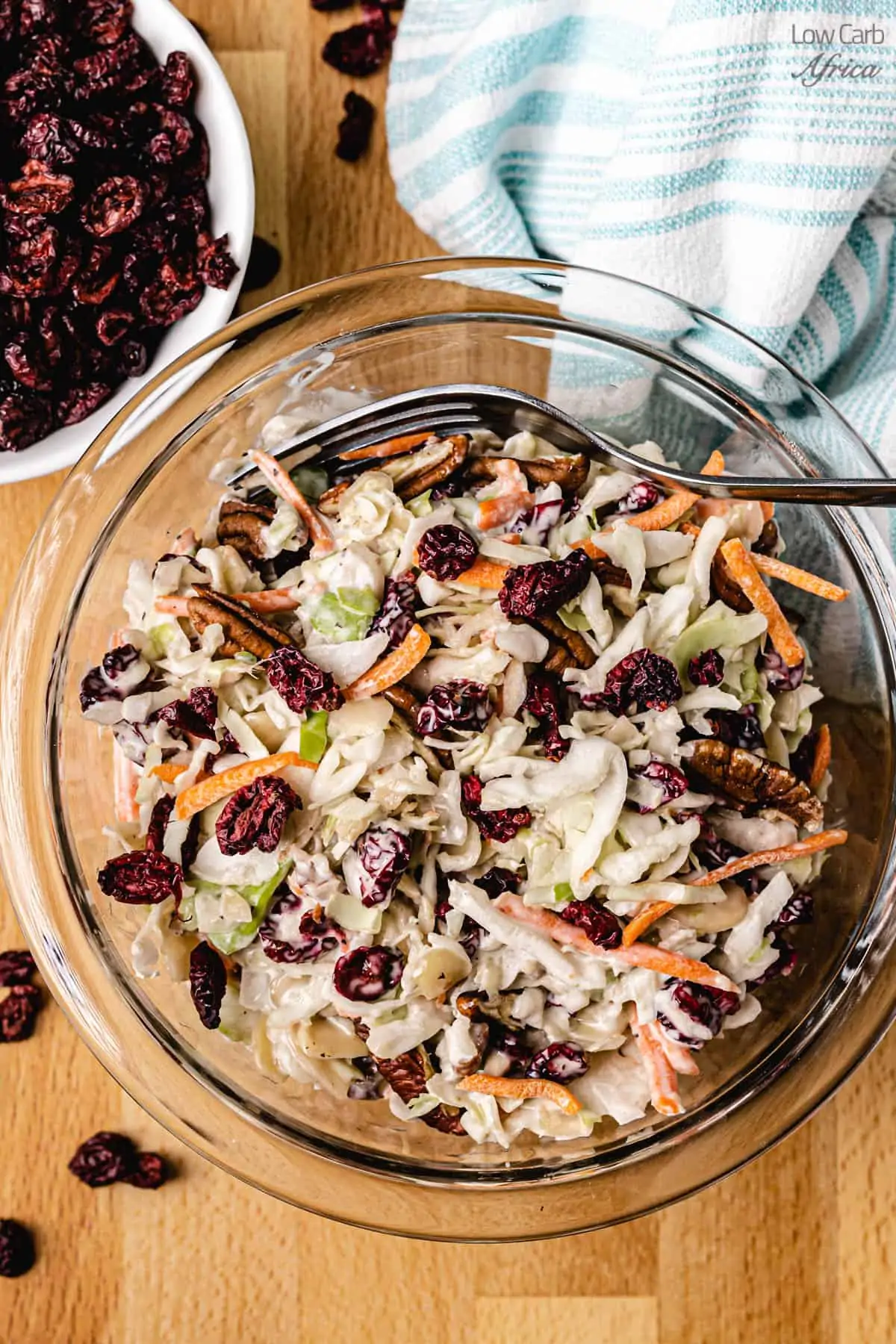 keto cranberry almond salad with cranberries on the side.