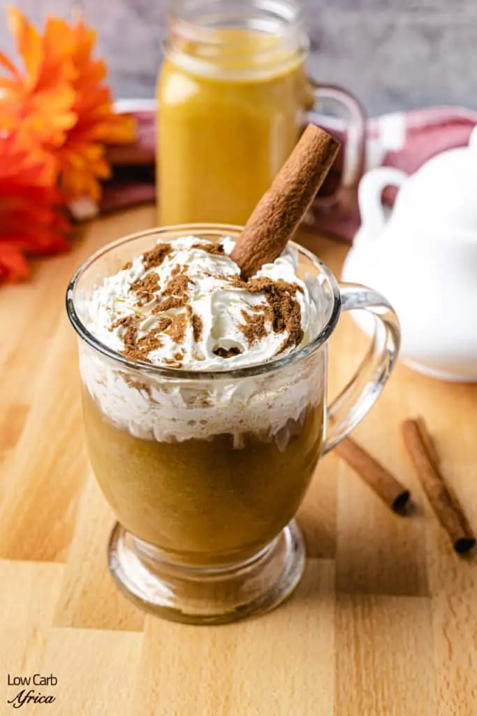 keto pumpkin spice latte with creamer in background
