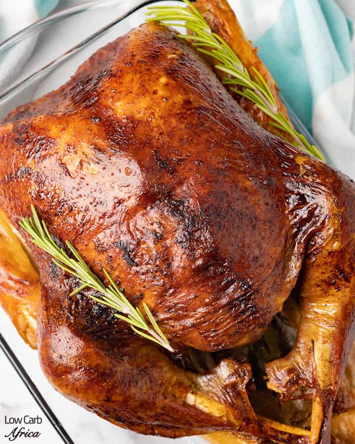 roast turkey garnished with herbs