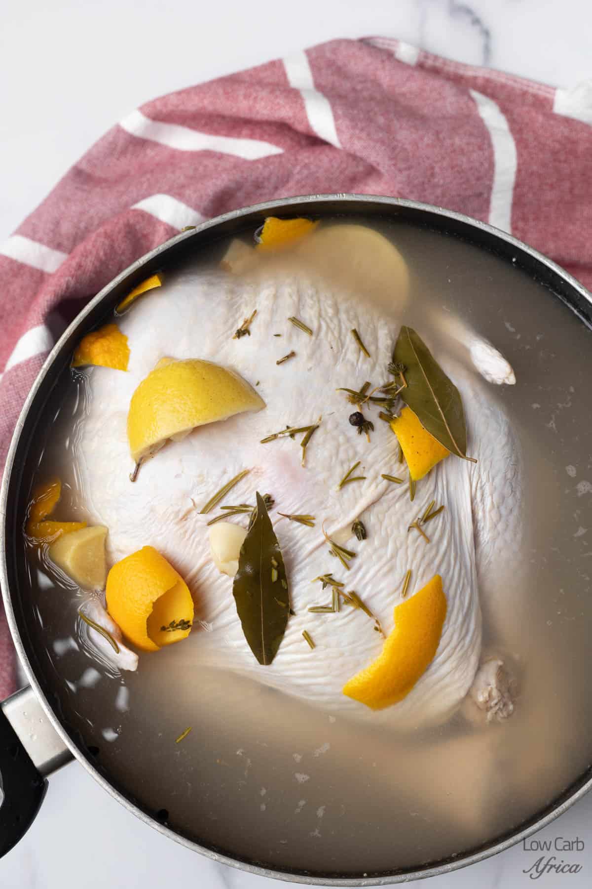 chicken brine in a pot with orange zest