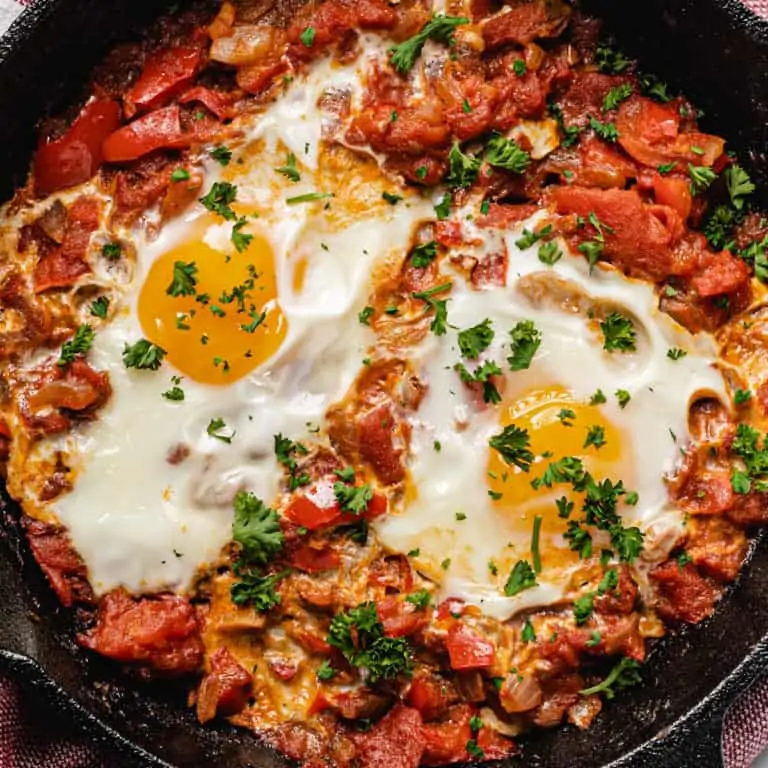 closeup of shakshuka in cast iron pan