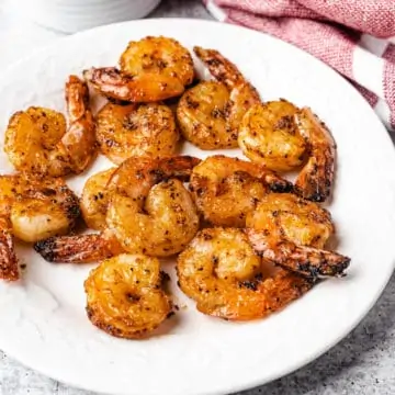 air fryer shrimps on a white plate