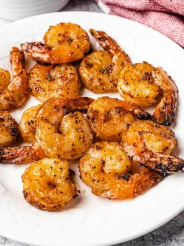 air fryer shrimps on a white plate