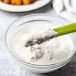 Keto Blue Cheese Dressing celery dipped in keto blue cheese dressing
