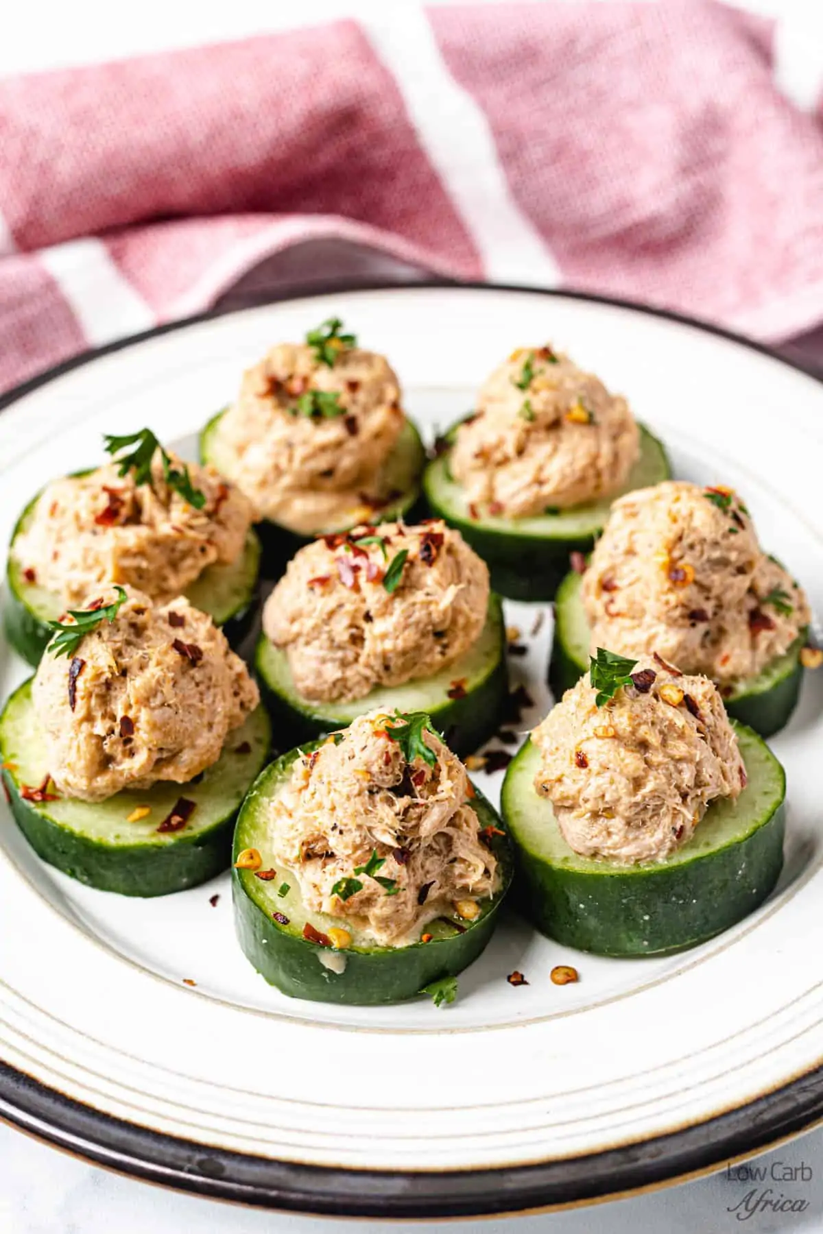 Low carb cucumber bites on white plate