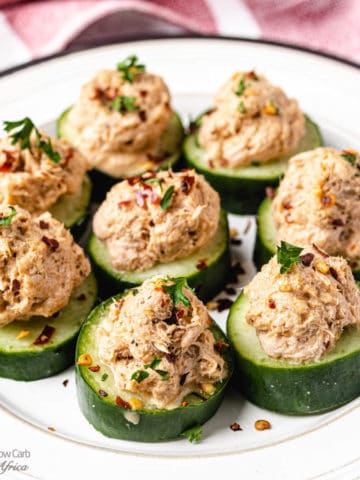 low carb cucumber bites on a white plate