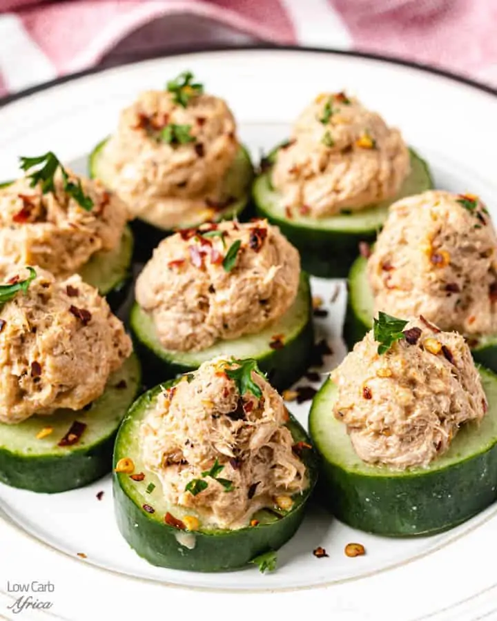 low carb cucumber bites on a white plate