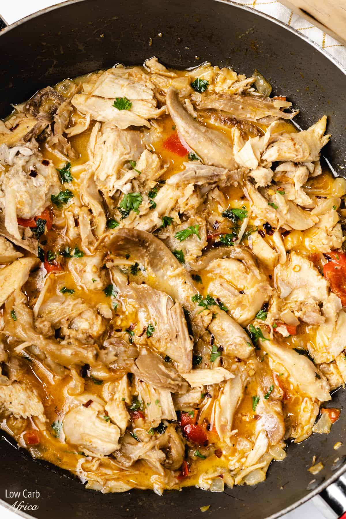 healthy low carb turkey soup in a skillet.