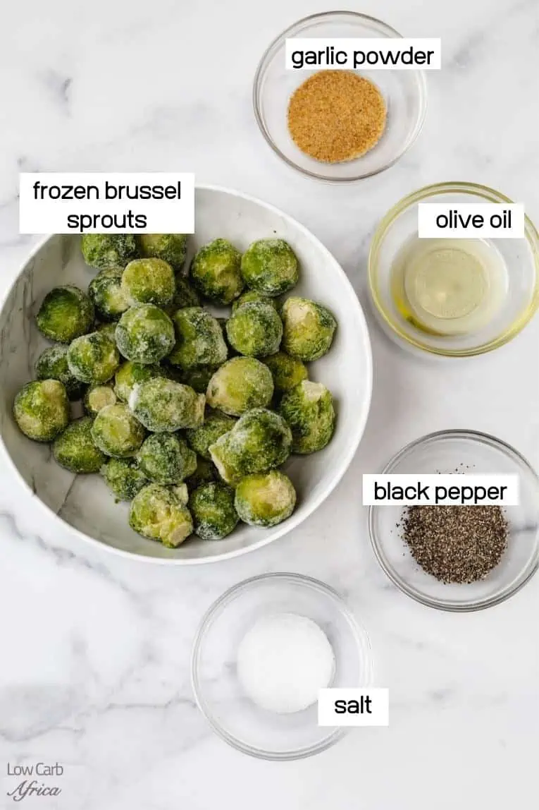 frozen sprouts, olive oil, spices on a marble background.