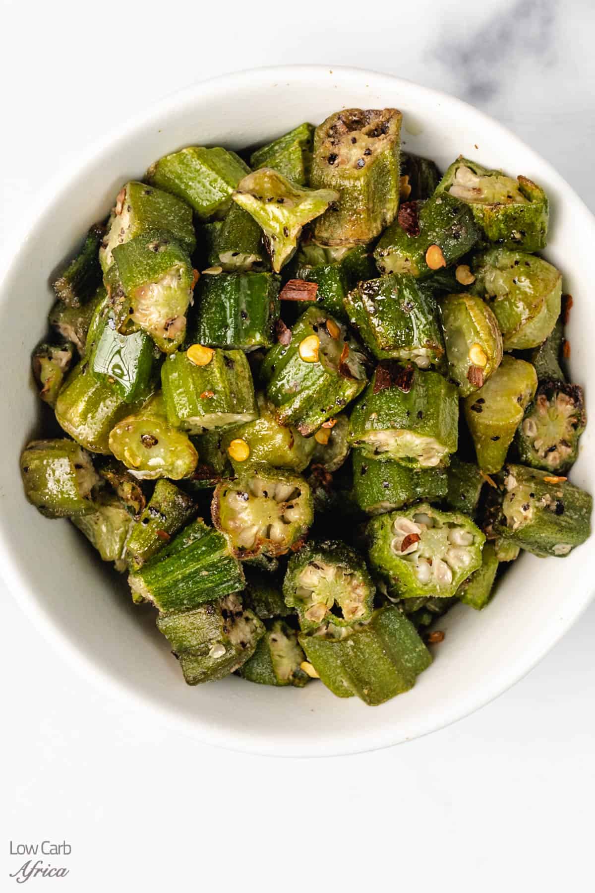 okra made in the air fryer in a white plate