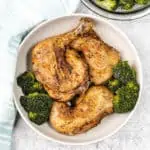 Instant Pot Chicken Leg Quarters plate of chicken legs with broccoli