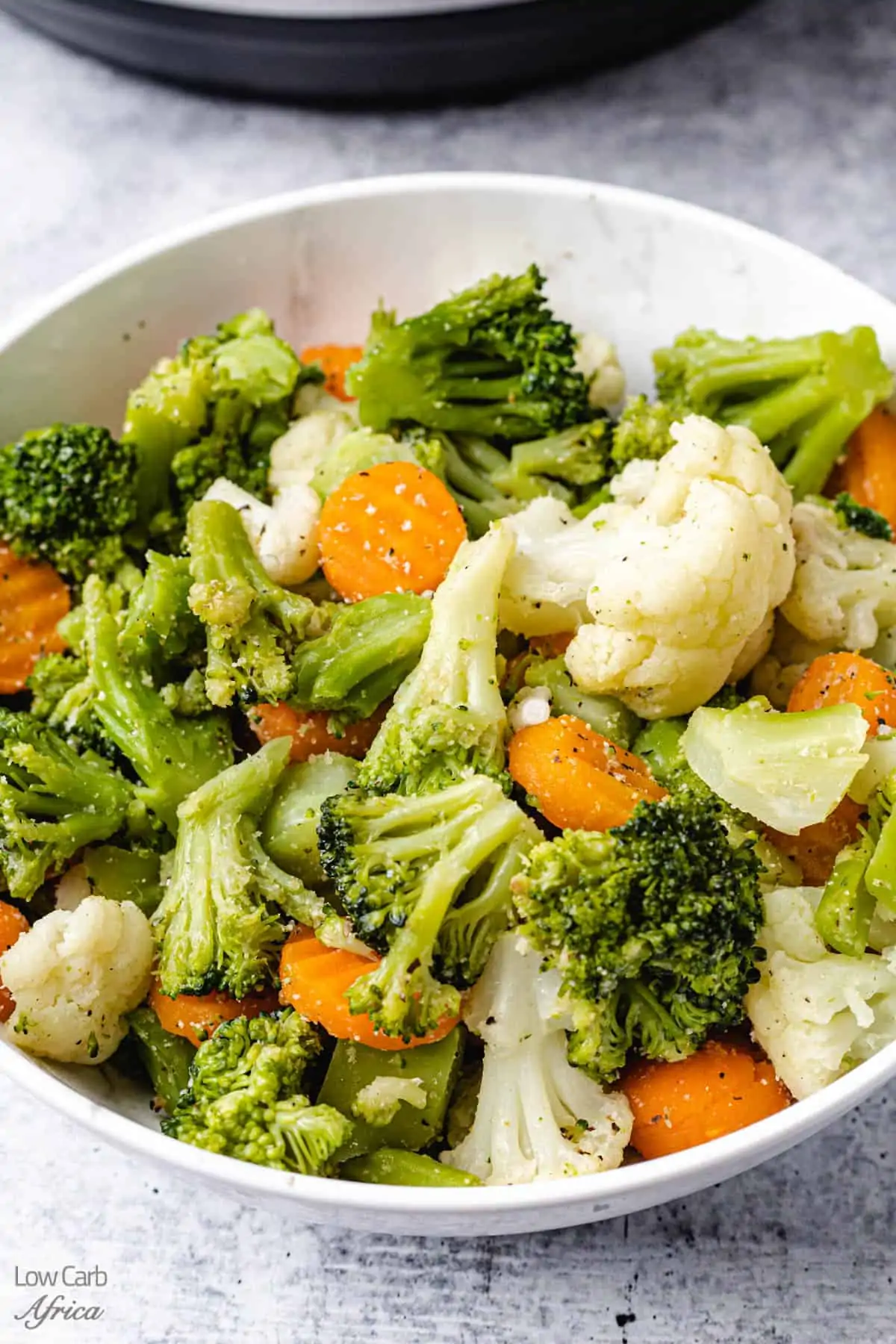 Steamed vegetables in a white plate