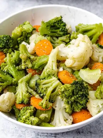 steamed vegetables in a white plate