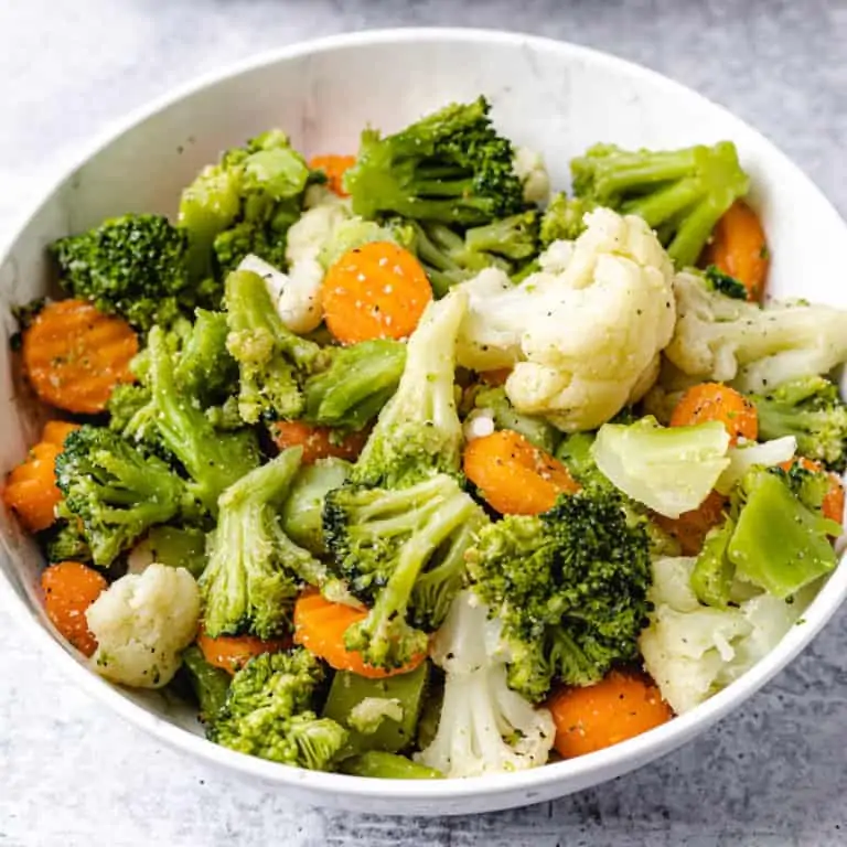 steamed vegetables in a white plate