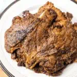 ninja foodi pork chops on a white plate