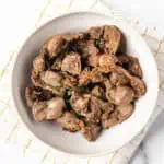 air fryer chicken gizzard on a white plate.