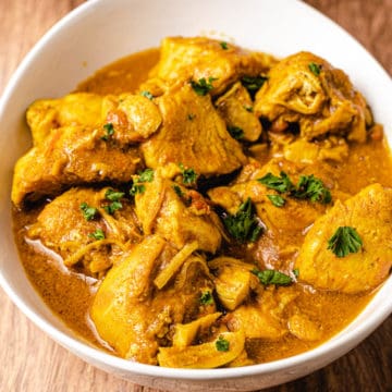 Instant pot chicken curry in a white bowl