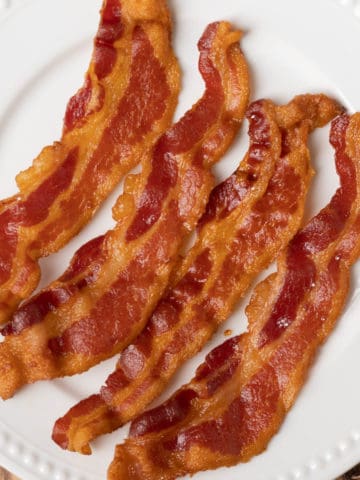 ninja foodi bacon on a white plate