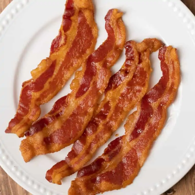 ninja foodi bacon on a white plate
