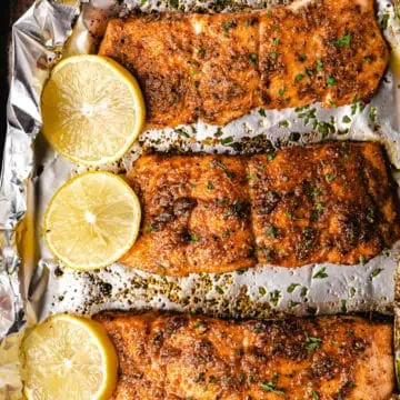oven baked salmon with lemon wedges