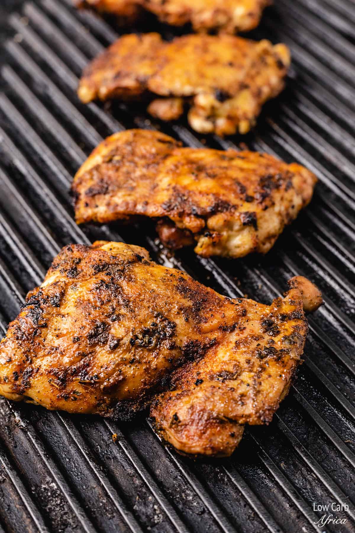boneless chicken thighs on a grill
