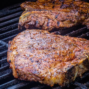t-bone steak on a grill.