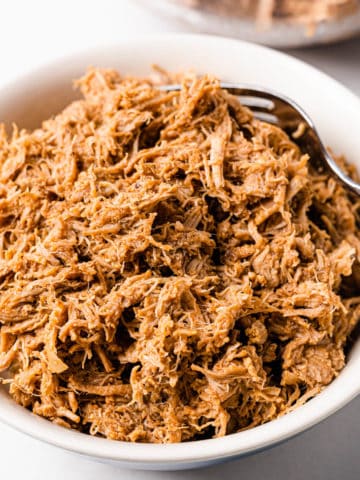 Instant Pot Pulled Pork in a white bowl
