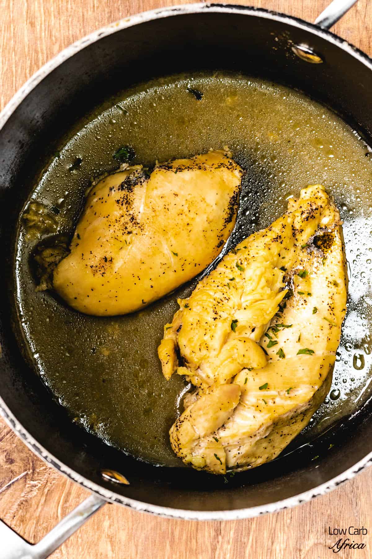 boiled chicken breast in a pot