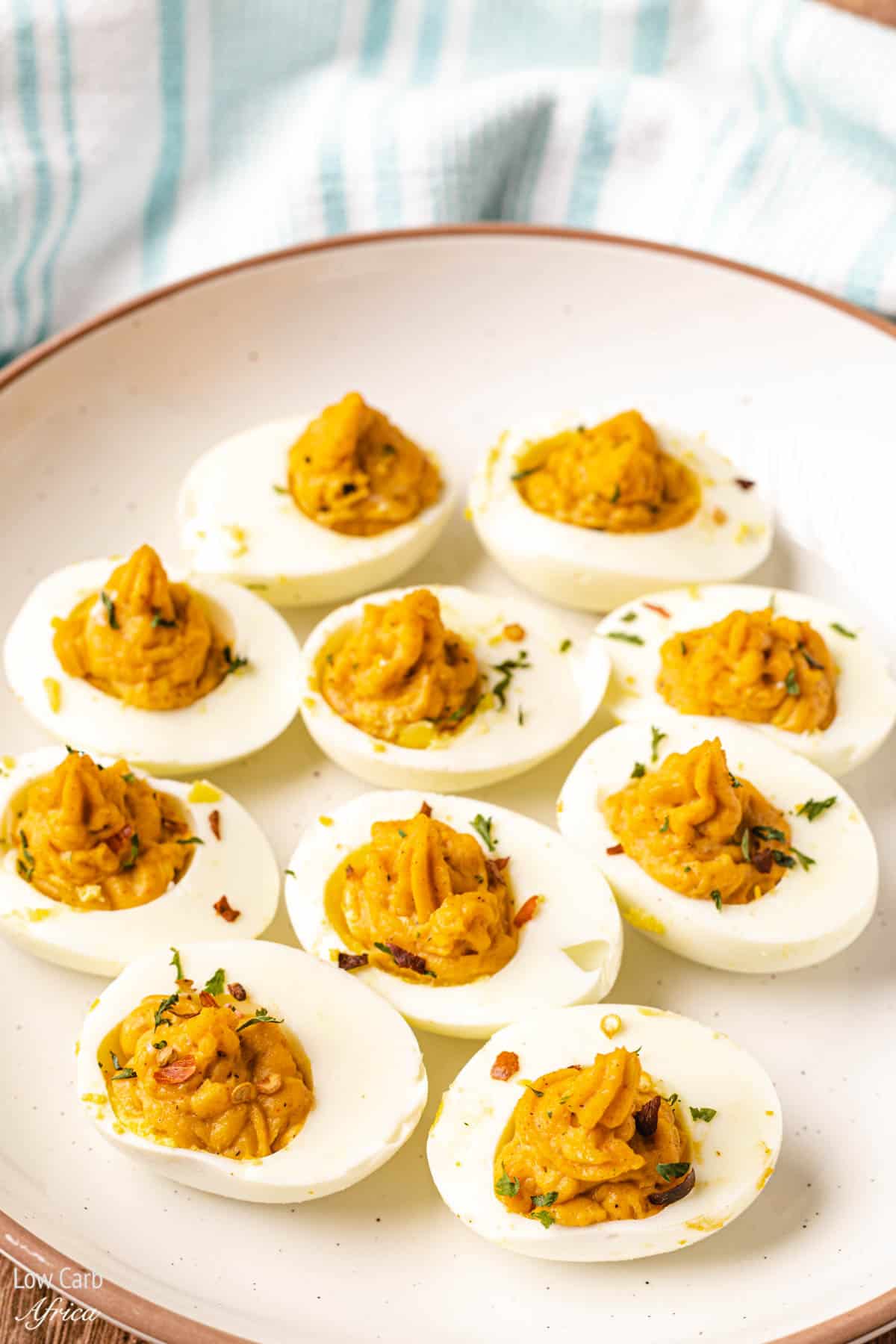 keto deviled eggs on a white plate